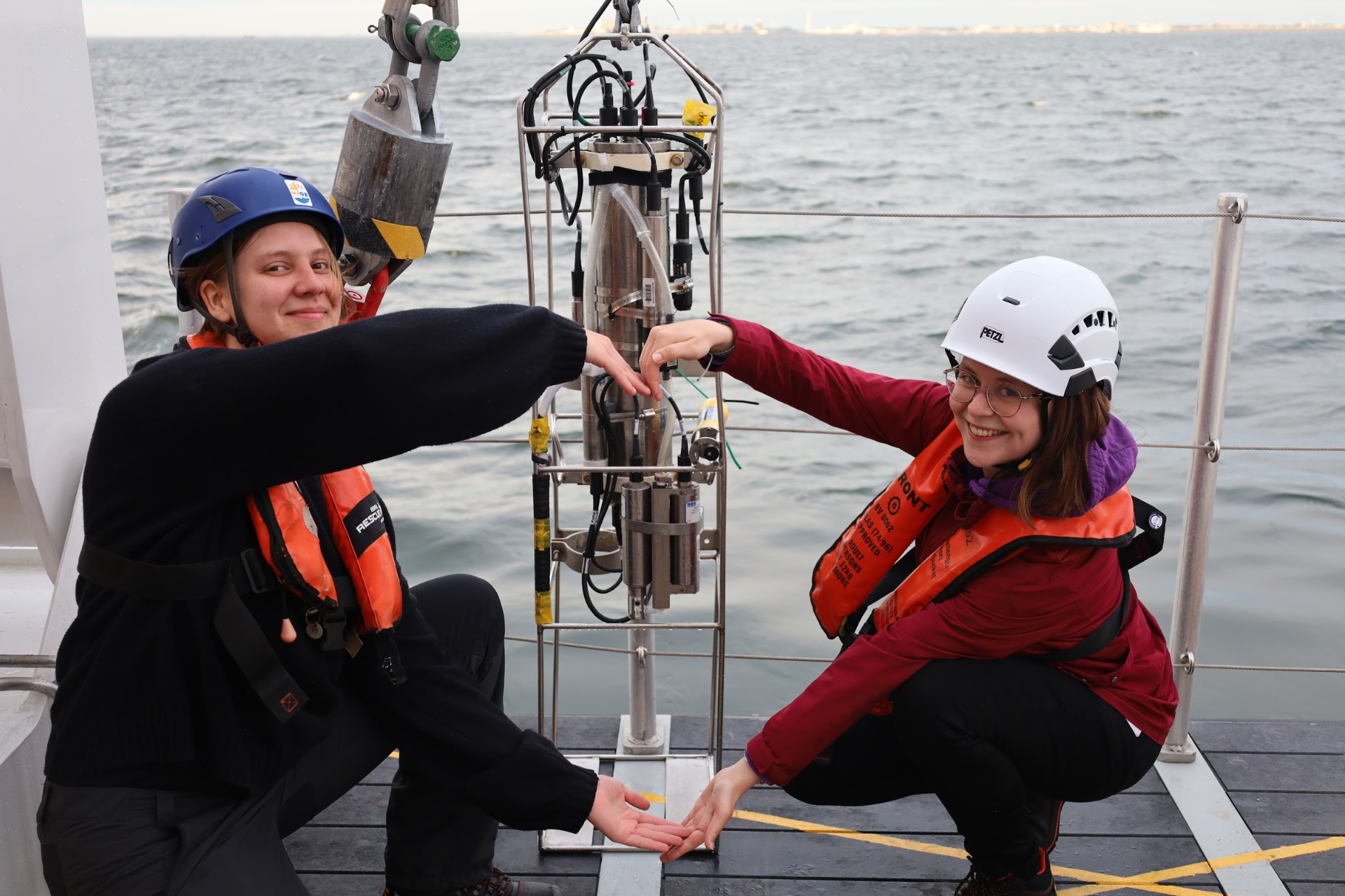 CTD on board of the research vessel Wim Wolff. From left to right: Astrid Moosmüller, CTD, and Marloes Vaessen. Photo by Mira Anguelova.