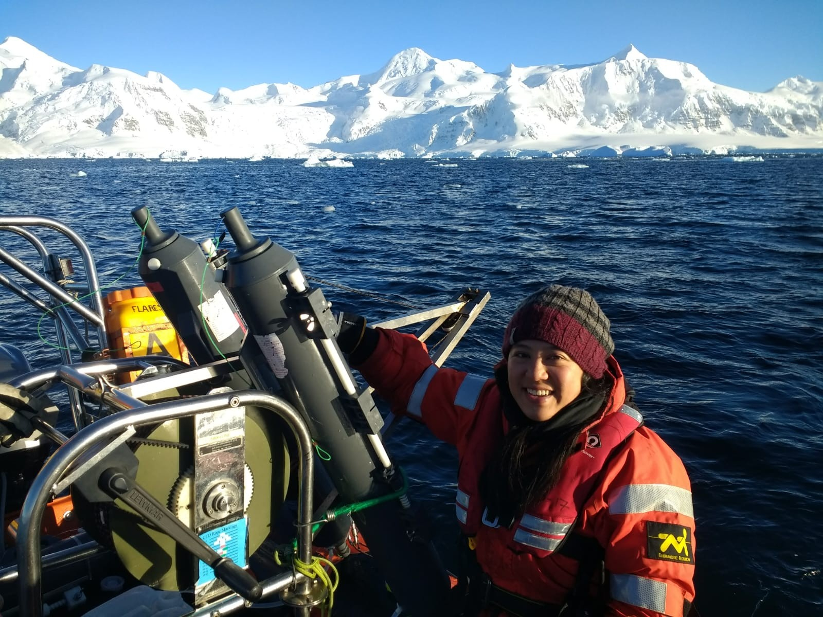 First author Swan Sow, heading out for seawater sampling from the Rothera long-term ecological monitoring site of the British Antarctic Survey. (Personal archive Swan Sow, 2022)