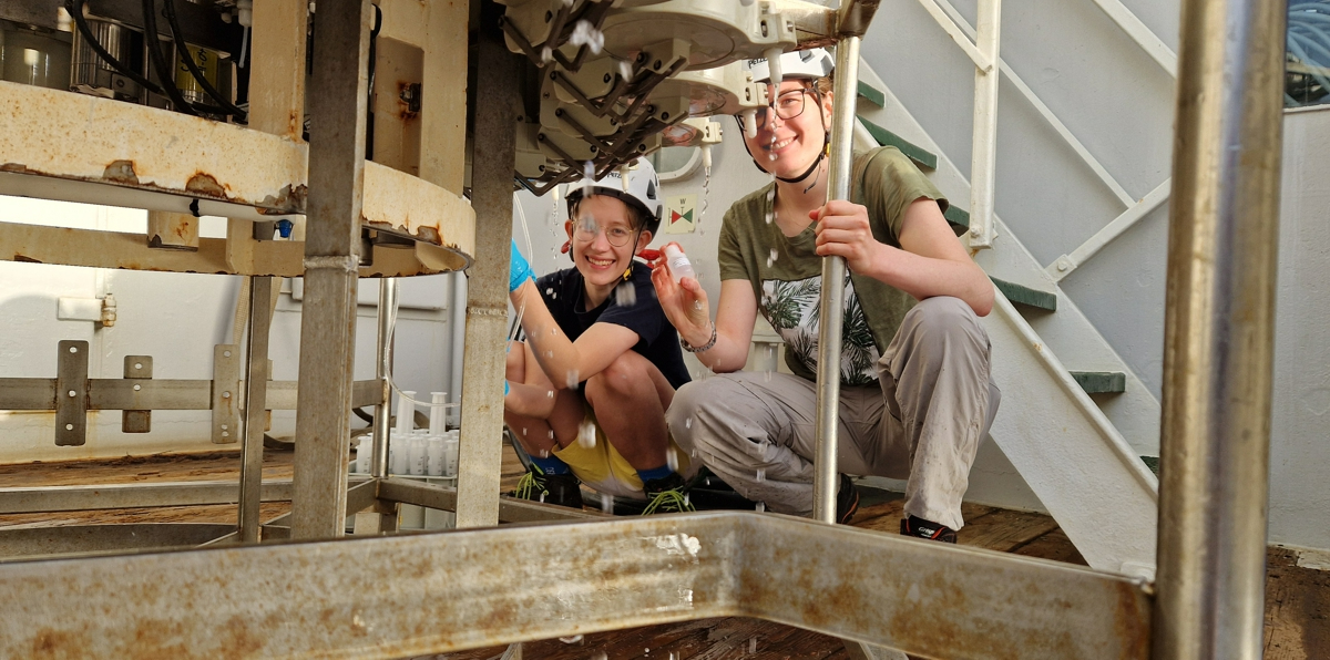 The cold water from the CTD is poured into small vials to be analysed at home in the lab.